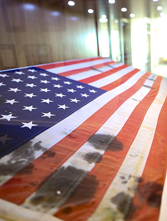 A U.S. flag recovered, bullet scarred and oil-stained, after the attack on Pearl Harbor is on display in the Liberty University Jerry Falwell Library.
