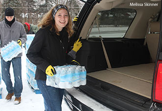 Liberty University students load water in vehicles for Flint, Mich. residents.