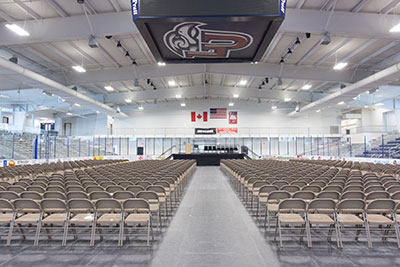 A stage and chairs cover the ice at Liberty University's LaHaye Ice Center.