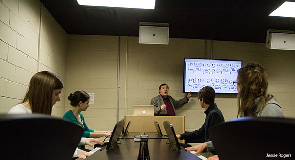 Liberty University students learn in a piano lab.