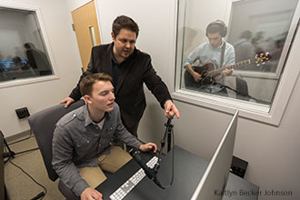 Liberty University students and a professor hold a recording session in one of the new songwriting labs on campus.