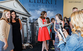 CWA President Penny Nance takes photos with Liberty University students.