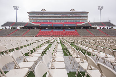 Chairs are set up in Liberty University's Williams Stadium.