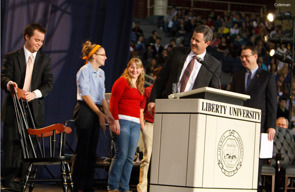 Jerry Falwell Jr presents rocking chair to former senior campus pastor Dwayne Carson