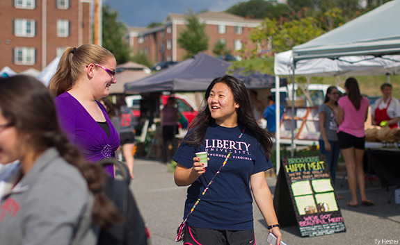 Liberty University students connecting with local produce vendors at the Liberty Farmer's Market