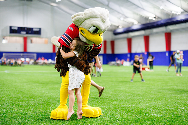 Families enjoy a back to school event for the Flames Kids Club at the Liberty Multipurpose Center on Aug. 11. (Photo by KJ Jugar)