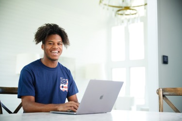 LUOA student working on dual enrollment courses at home