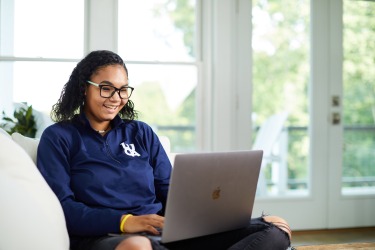 LUOA student working from home on laptop