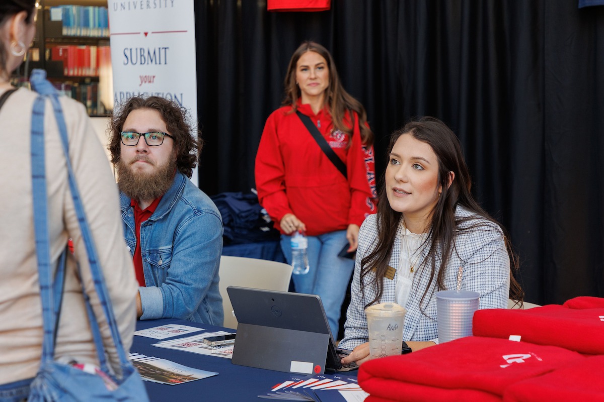 LUOA faculty/staff meeting with parents/students during an Open House