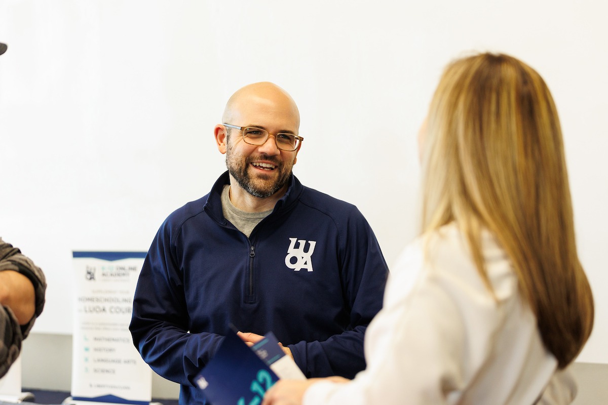 LUOA faculty/staff meeting with parents/students during an Open House