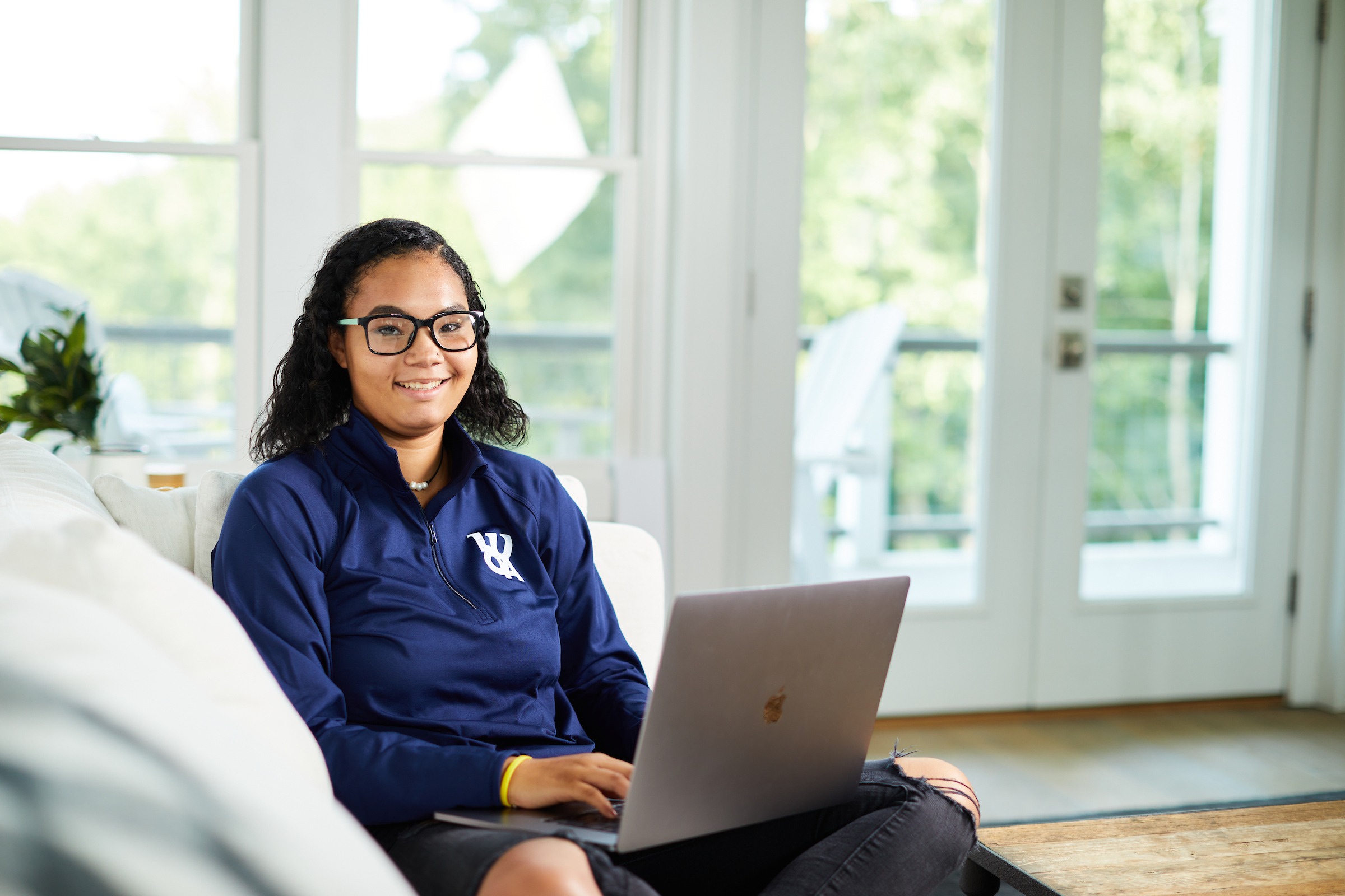 Female LUOA student working on a laptop