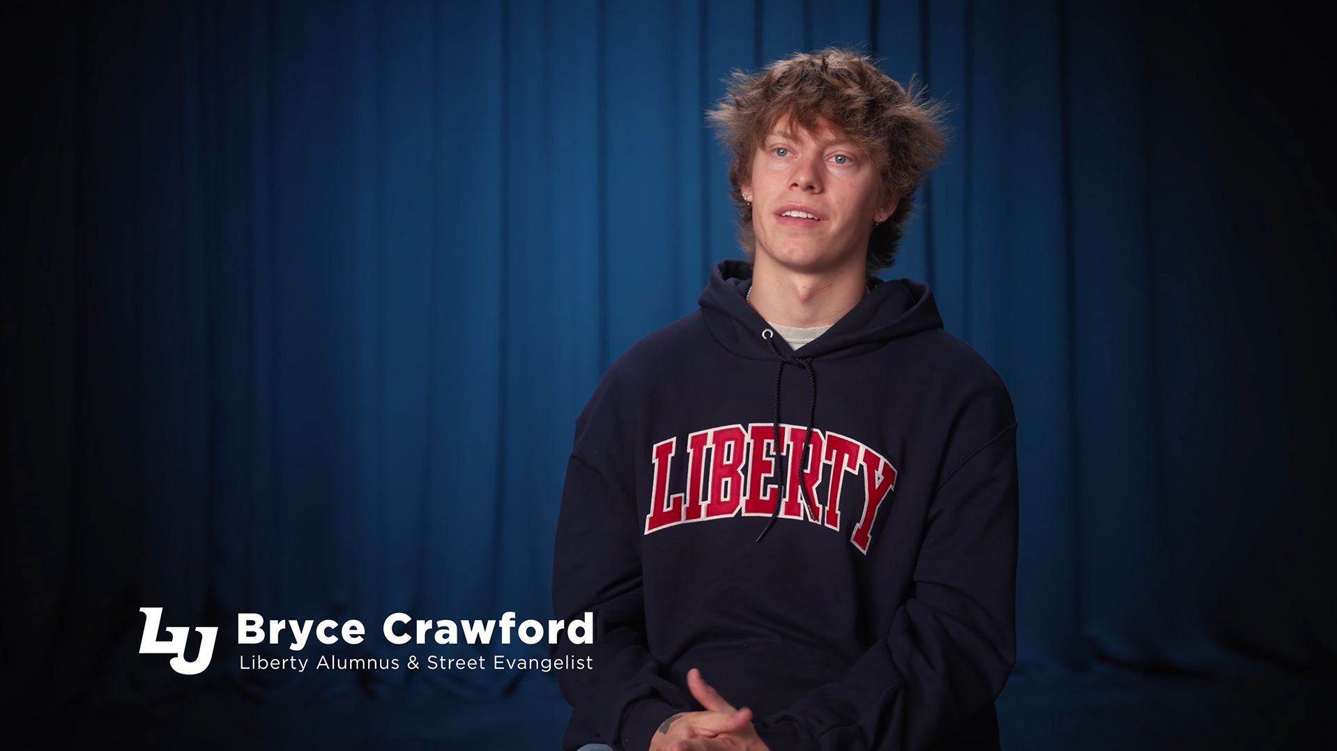 Bryce Crawford giving an interview on how it feels to be a graduate of Liberty University