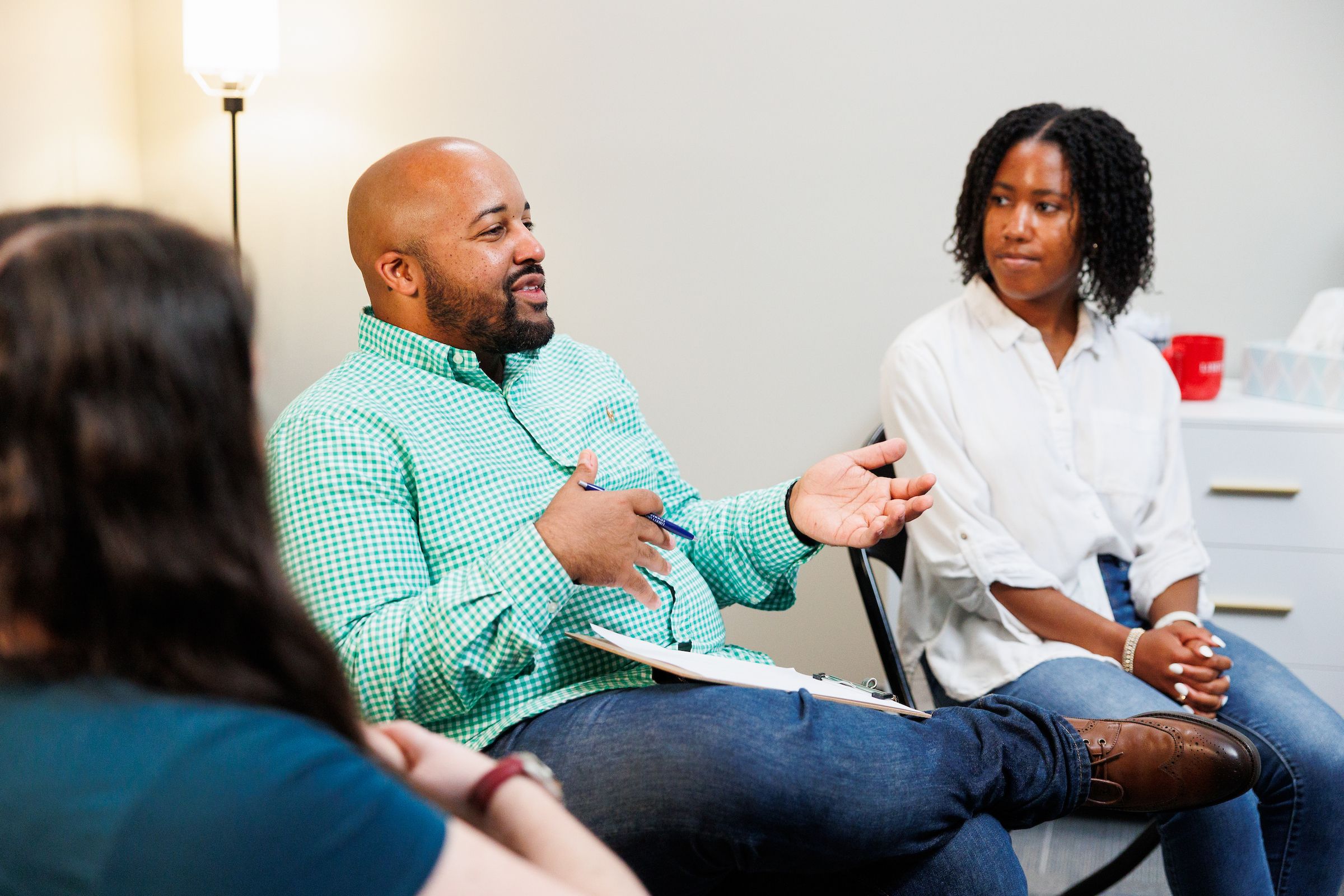 Male pastoral counselor leading a group session