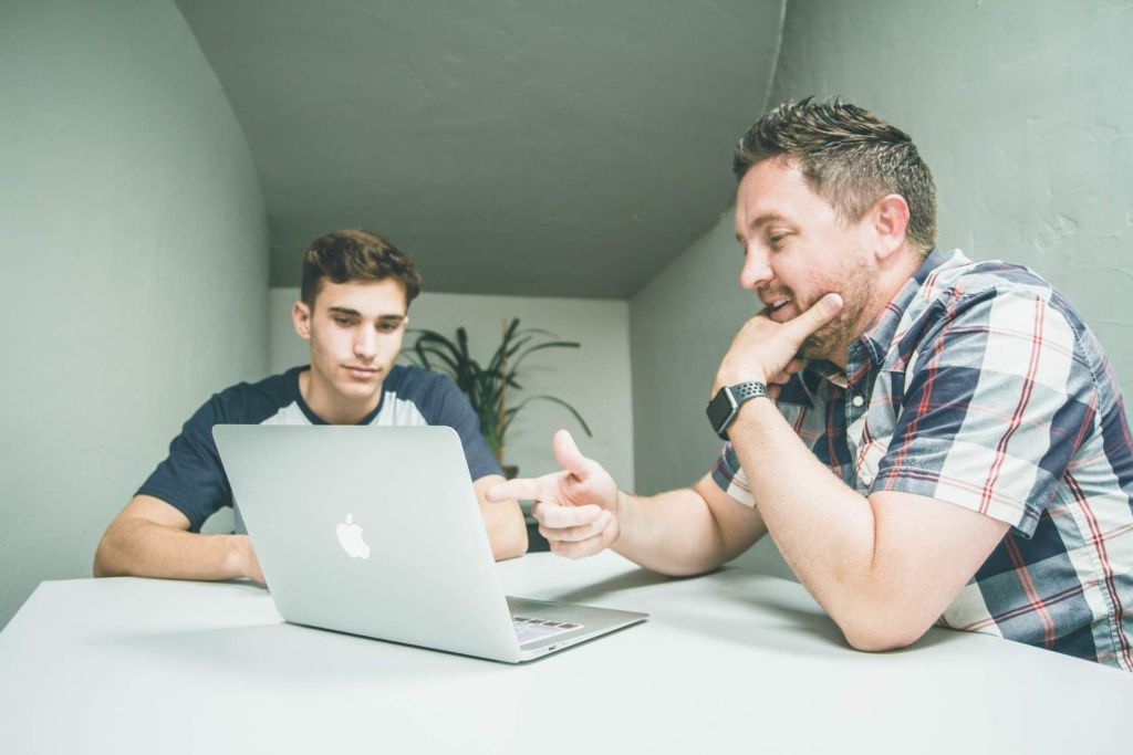 A parent and their student on a laptop