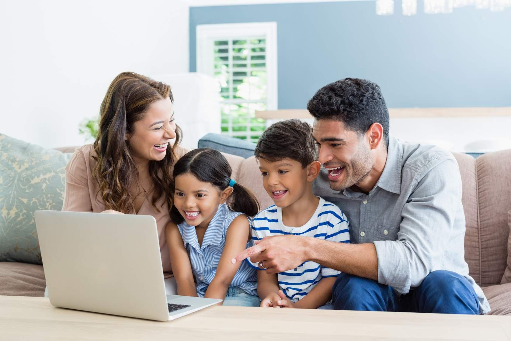 An Ember family looking at course content on a laptop