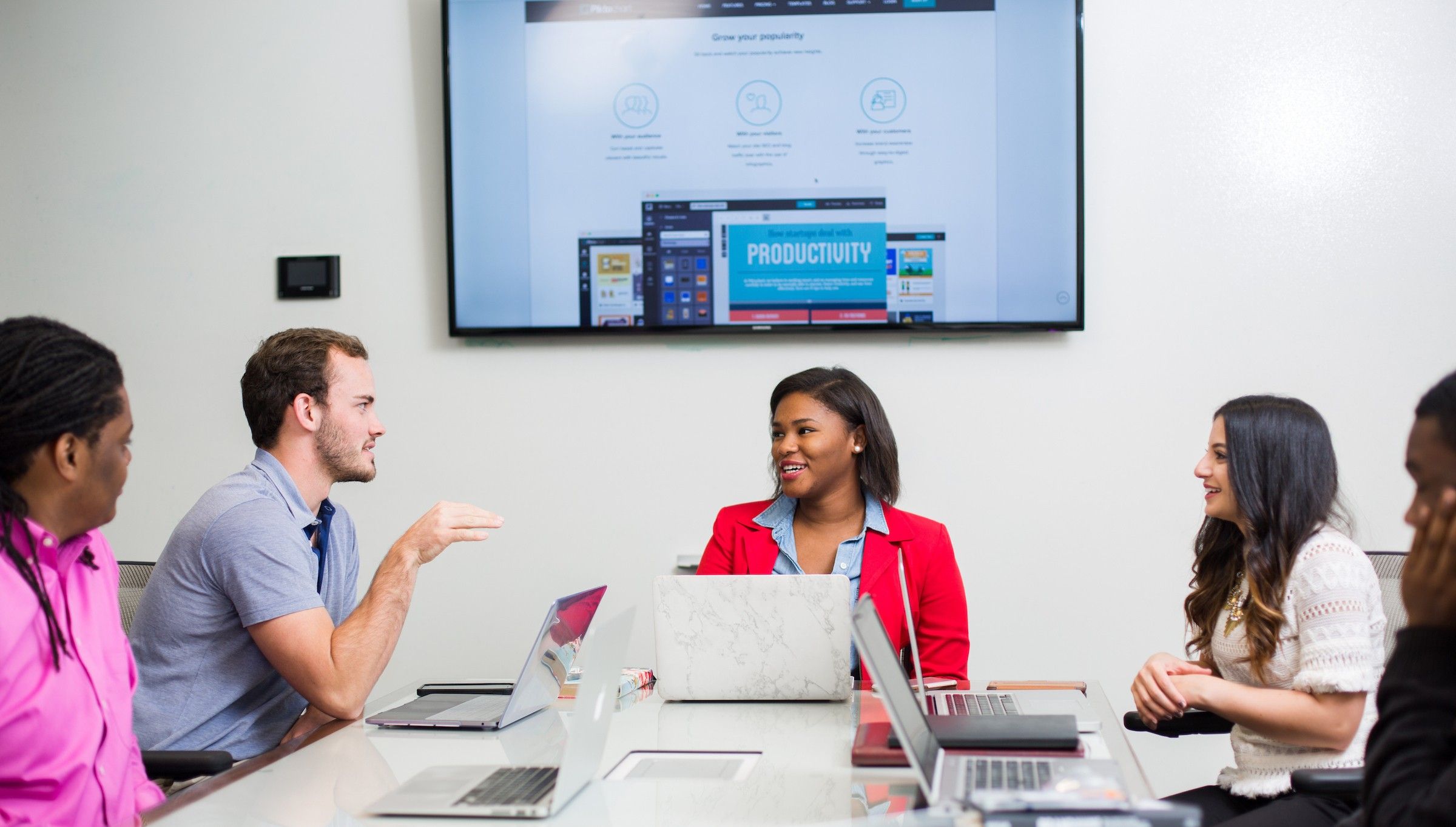 A group of advertising professionals discusses campaign strategy
