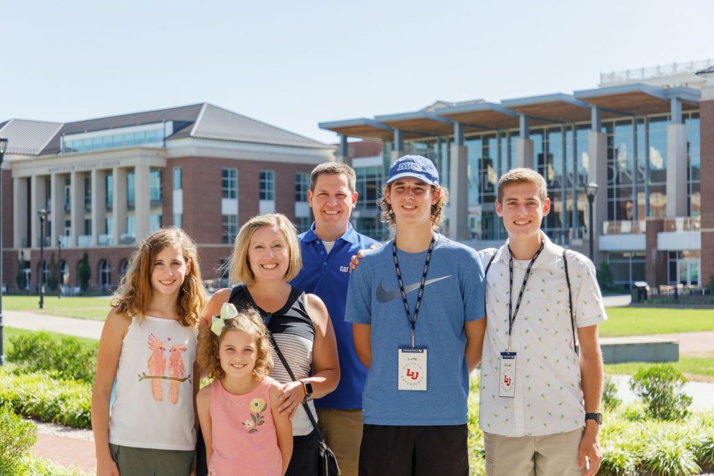 Prospective student and family enjoying Liberty's campus on a summer tour