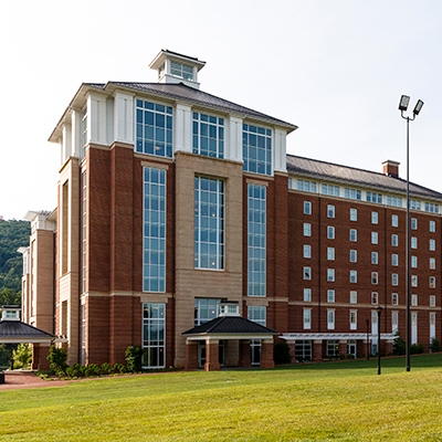 Brick and concrete exterior of the 8-floor Residential Commons dorm