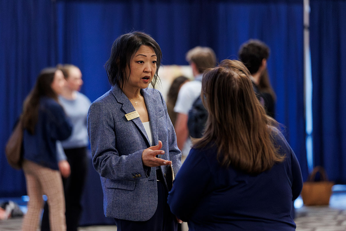 Dr. Ester Warren speaks with students at a Disability Advocacy Expo in February.